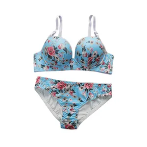 Floral print lingerie set with light blue bra and panties in silky satin fabric