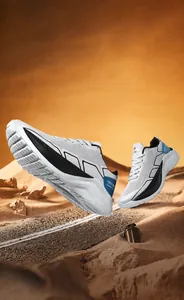 Close-up of breathable mesh men's running shoes with thick soles and blue heel accents