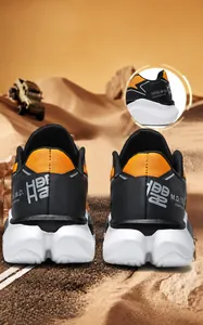 Detail of outdoor running shoes with orange black mesh and thick cushioned sole
