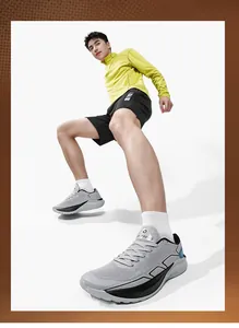 Dynamic low-angle view of breathable mesh running shoes with thick cushioned soles