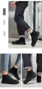 Detail of black high-top knit sneakers showing breathable mesh and thick rubber sole
