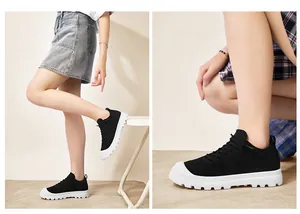 Close-up detail of breathable mesh fabric and white non-slip sole on black sneakers