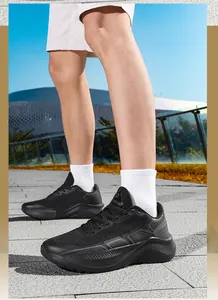 Detail of all-black breathable mesh climbing shoes with thick anti-slip rubber outsoles