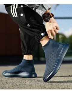 Detail of navy knit sock sneaker showing breathable texture and elastic cuff on model
