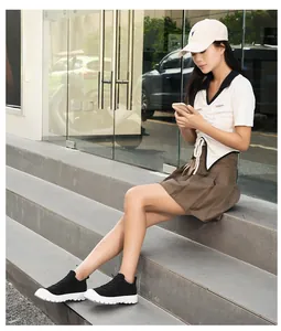 Outdoor shot of breathable mesh hiking sneakers with thick white anti-slip soles