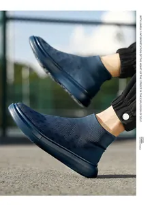 Detailed view of breathable navy blue knit sock sneaker with thickened EVA sole on foot