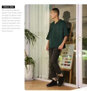 Close-up of the short-sleeved hooded work shirt featuring dual chest pockets and green fabric