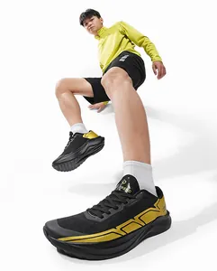 Action shot of men's black and gold running shoes with breathable mesh and thick soles