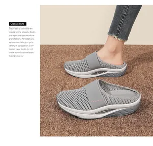 Detail view of grey breathable mesh mule with cushioned air sole and elastic strap