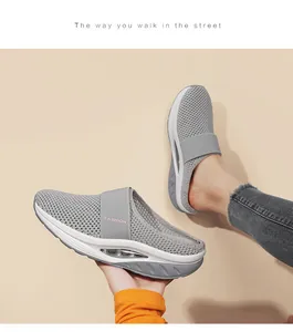 Detail of grey mesh platform mules featuring a clear heel air cushion for shock absorption
