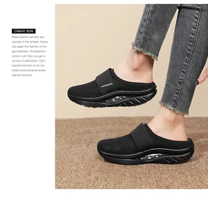 Detail of breathable black mesh platform sandal with air cushion and FASHION strap