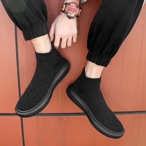 Classic black knit sock sneakers for men featuring a lightweight thick sole on model