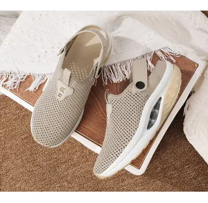 Detailed macro view of breathable beige mesh sandals with air-cushioned soles