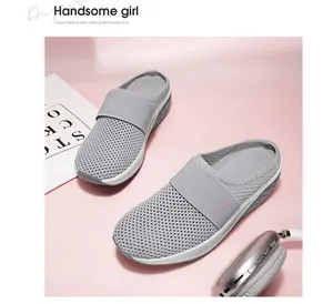 Detail of grey mesh mule sneaker with air cushion sole and pink fashion text strap