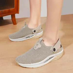 Women's beige mesh sports sandals with thick ergonomic soles and adjustable heel straps