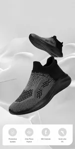 Close-up of grey knit sneakers with geometric mesh and breathable slip-on collar