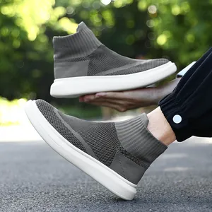 Dark grey knitted sock sneakers for men and women with chunky white rubber soles