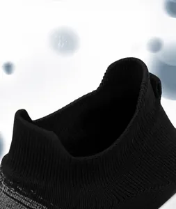 Macro detail of the elastic ankle cuff on these black breathable knitted walking sneakers