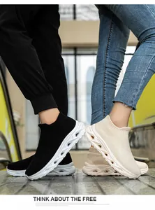 Close-up of flexible knit upper and thick wavy rubber sole on stylish sock sneakers