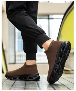Detailed side view of brown flyknit sock sneaker featuring a thick cushioned hollow sole