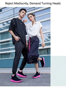 Outdoor shot of breathable knit sneakers in black and pink for men and women