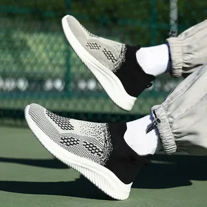 Breathable mesh platform walking shoes for men and women on a green athletic track