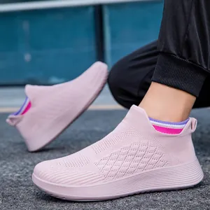 Pink breathable slip-on mesh sneakers with elastic striped collar for walking