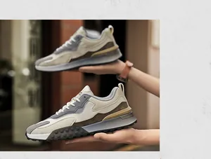 Detail of multi-color paneled suede sneakers with thick anti-slip soles and fashion text