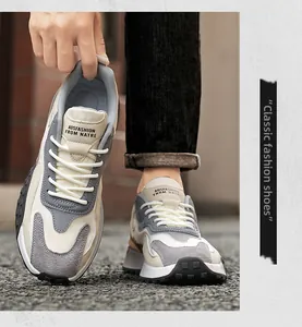 Detailed view of breathable mesh and grey suede layering on fashionable outdoor sneakers