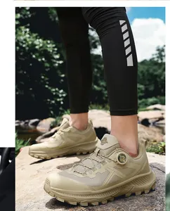 Detail of khaki outdoor hiking shoe featuring breathable mesh and quick lace knob system
