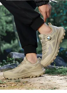 Detail of khaki hiking shoe featuring a quick-lace swivel buckle and rugged anti-slip sole