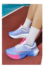 Close-up of breathable mesh running shoes with gradient purple and blue colors on a track