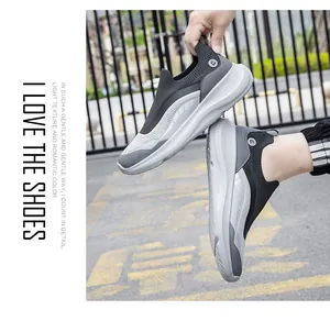 Close-up of gray slip-on mesh sneakers featuring thick cushioned soles and breathable fabric