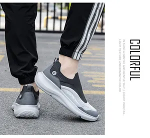 Detail of grey mesh knit sports shoes with cushioned thick sole and sock-like collar