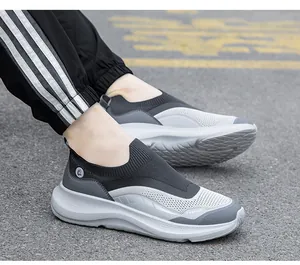 Detail view of breathable knit mesh fabric and shock-absorbing sole of outdoor sneakers