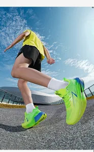 Dynamic low angle view of mesh running shoes with blue Z-logo and gradient green-blue design