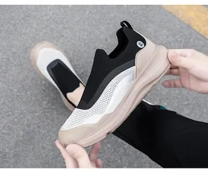 Close-up of flexible breathable mesh upper and cushioned thick sole on hiking sneakers