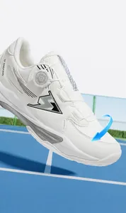 Detail of white tennis shoe with mesh upper and BOA rotary dial lacing system