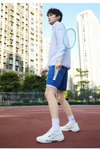 Outdoor sports outfit featuring a white running jacket, blue shorts, and tennis shoes