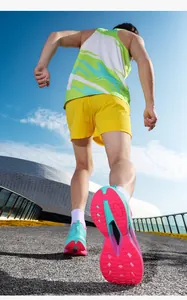 Dynamic low-angle shot of mesh running shoes with colorful gradient design on athletic track