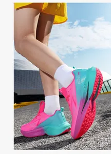 Outdoor low-angle view of pink and green gradient breathable mesh running sneakers