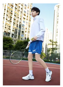 Outdoor shot of men's white sports jacket and blue shorts with classic running print