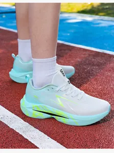 Detailed close-up of the breathable mint green mesh and wave-shaped cushioned sole