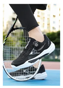 Close-up of black mesh tennis shoes with convenient dial lace system and thick white soles