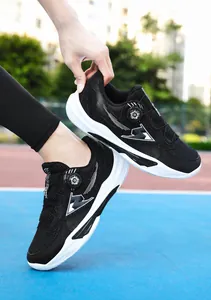 Detail of breathable black mesh athletic shoe with convenient rotary dial lacing system