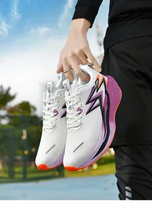 Close-up of lightweight marathon running shoes with white breathable mesh and purple details
