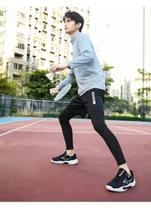Lightweight breathable sports outfit for badminton including grey top and black leggings