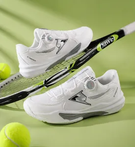 Detail of white tennis shoes with rotary dial lacing system and breathable mesh upper