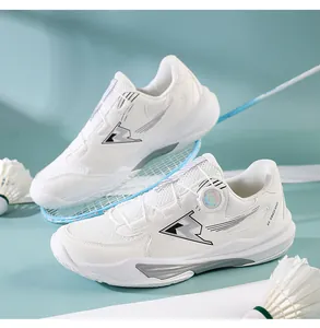 Macro shot of white badminton shoes with dial lacing system and breathable mesh