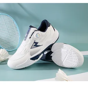 Detail view of white sports shoes with knob lacing system and breathable mesh upper